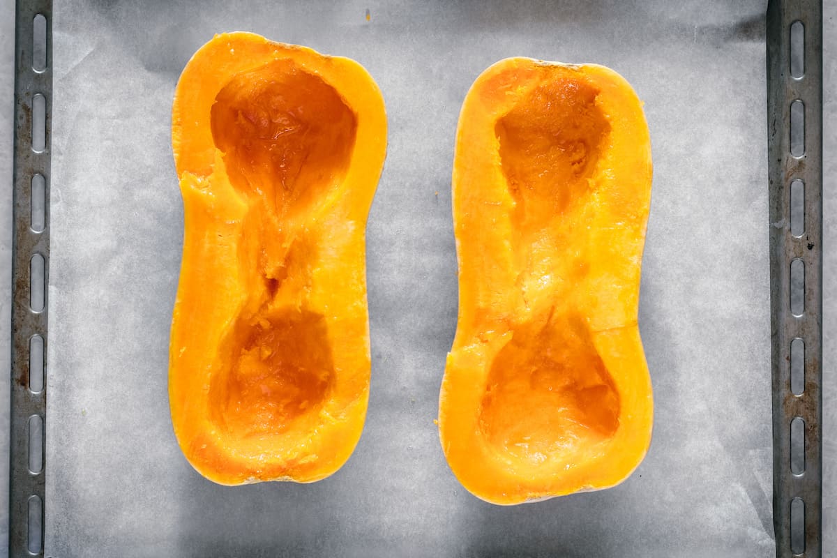 Two halves of a butternut squash with the insides removed