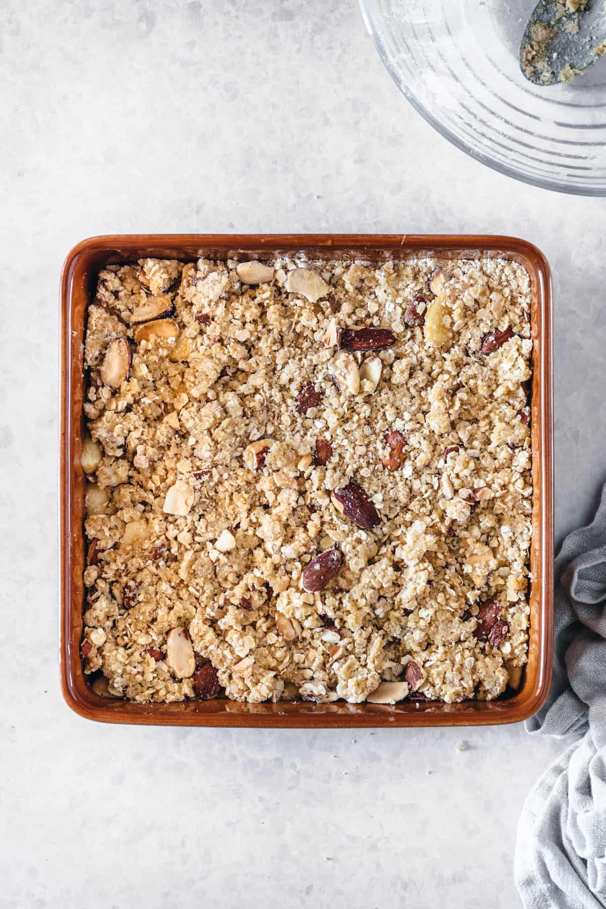 Caramel apple almond crisp in a baking dish