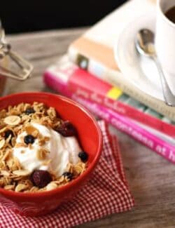 a bowl of yogurt with Granola and a cup of coffee