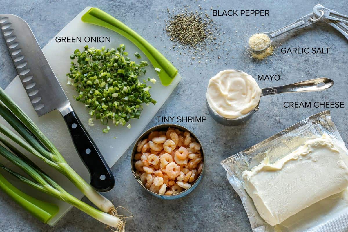 Green onions, cream cheese, mayo, tiny shrimp, black pepper, and garlic salt.