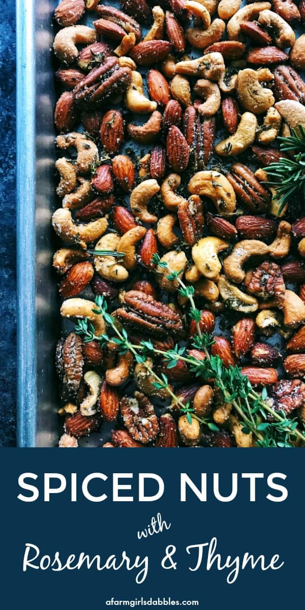 pinterest image of Rosemary Thyme Spiced Nuts with fresh sprigs of thyme