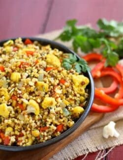 a bowl of curried cauliflower and couscous salad