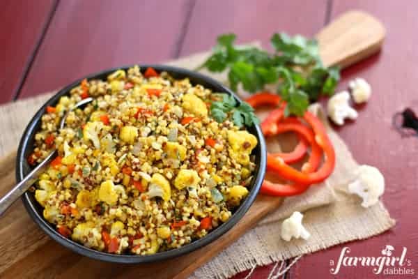 a bowl of curried cauliflower and couscous salad