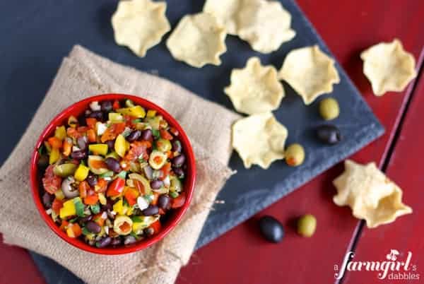 A Bowl of Black Bean Salsa Next to Some Tortilla Chips