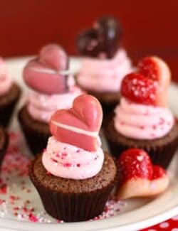 brownie bites topped with strawberry frosting and a truffle