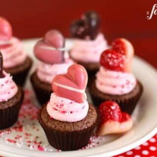 brownie bites topped with strawberry frosting and a truffle