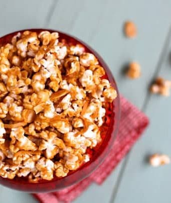 a red bowl of cinnamon caramel corn