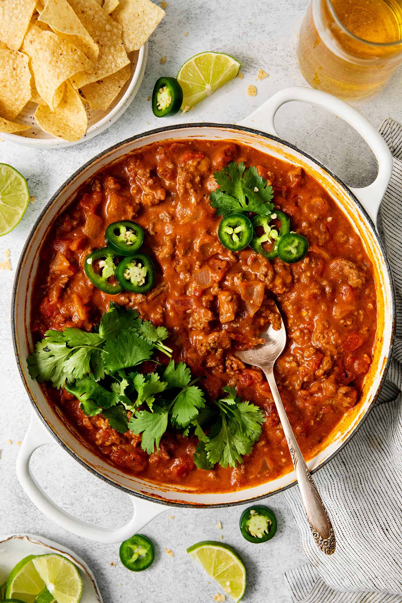 This Cheesy Beef Taco Dip is full of the beefy taco flavor you love, with ground beef, taco seasoning, Rotel, and loads of cheddar cheese. overhead view of cheesy beef taco dip in a skillet