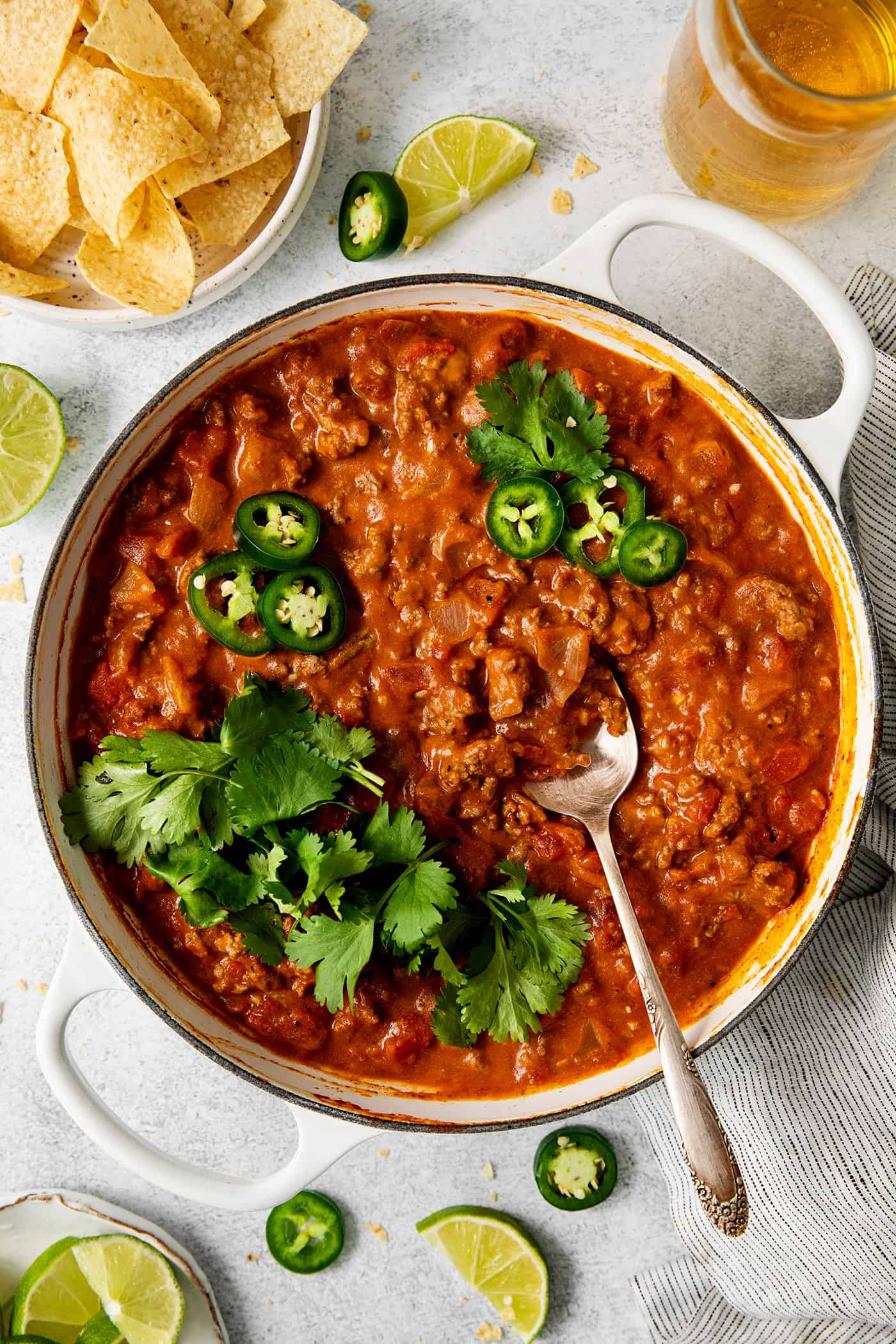 overhead view of cheesy beef taco dip in a skillet