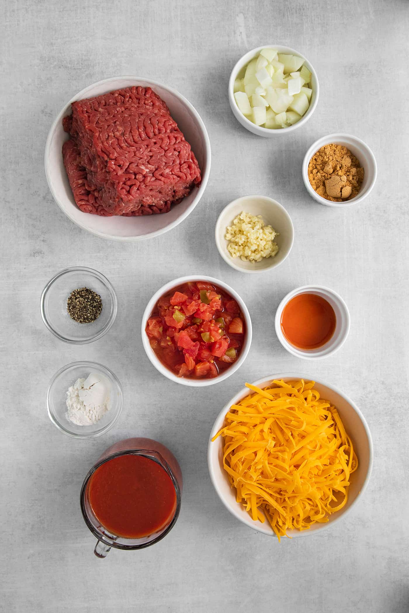 overhead view of cheesy taco dip ingredients