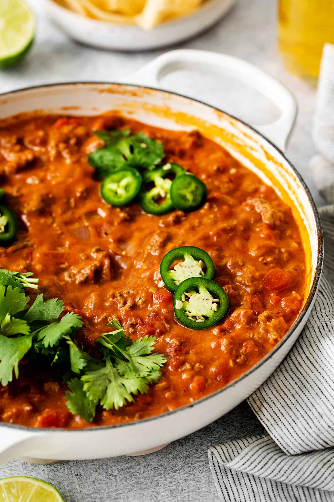 Cheesy ground beef taco dip topped with sliced jalapenos