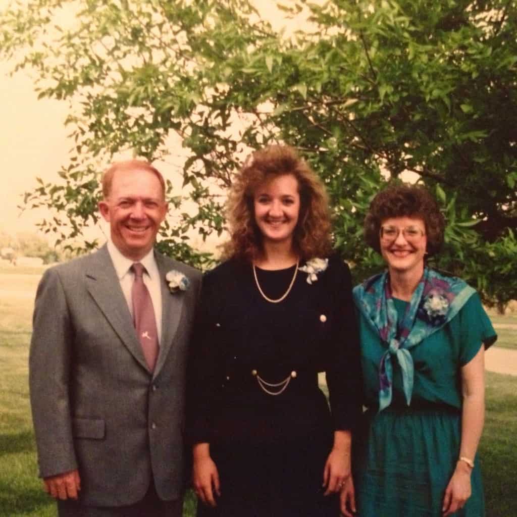 a graduate and her parents