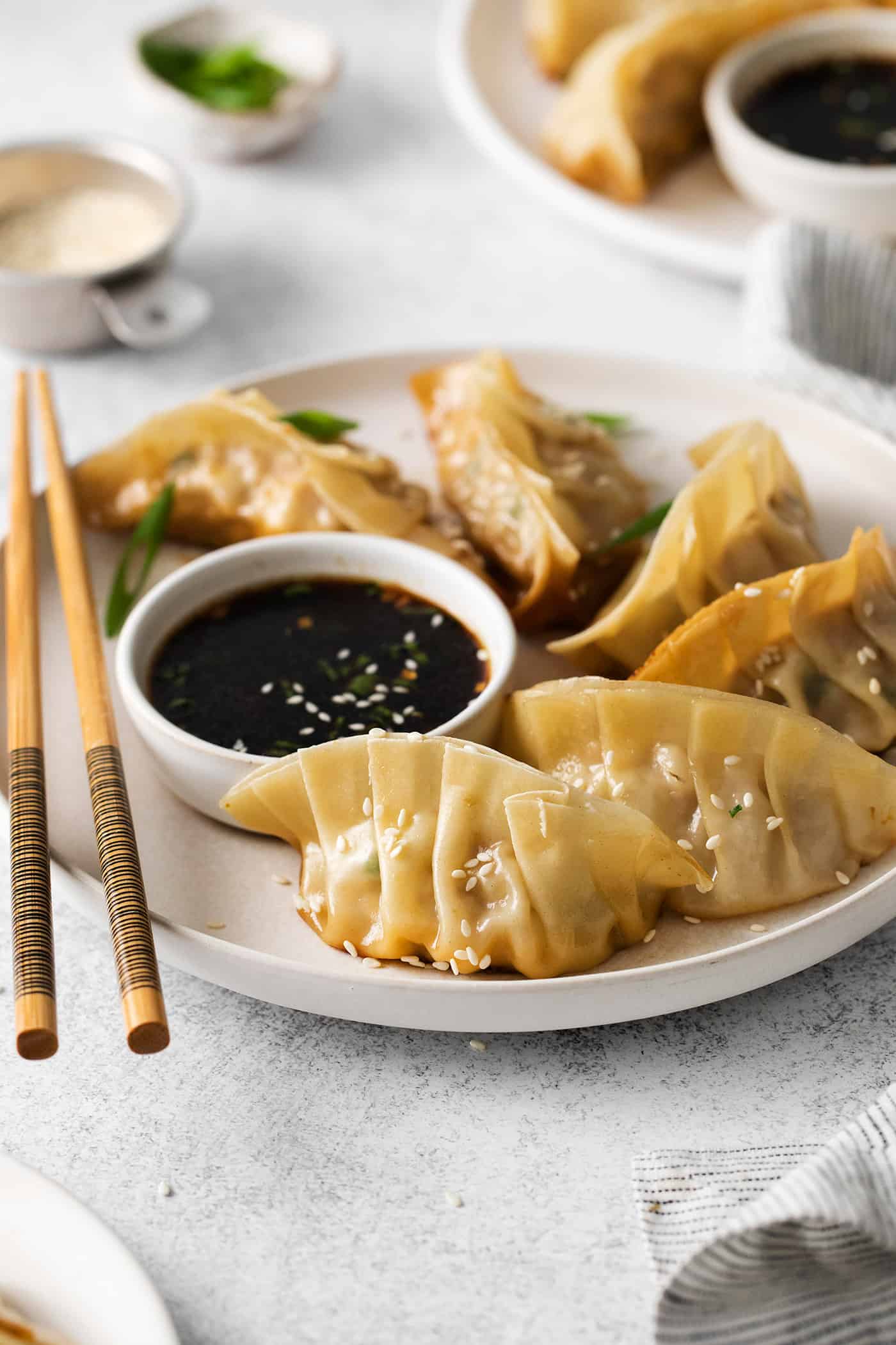 Angled view of a plate of potstickers