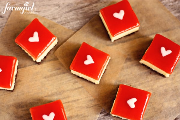 cheesecake squares on parchment paper