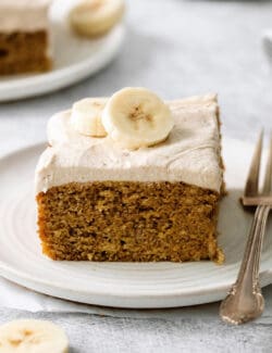 A slice of homemade banana cake on a plate