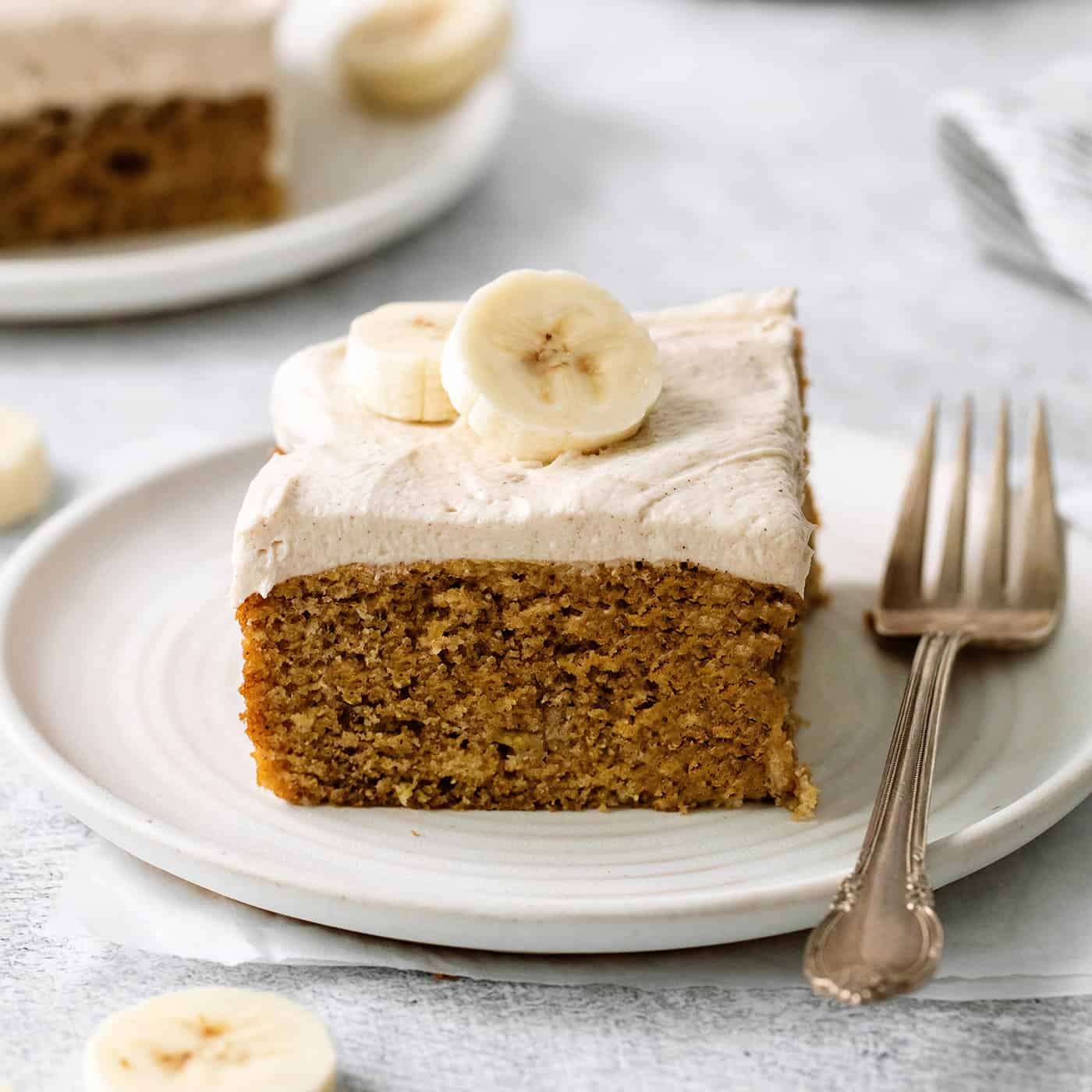 A slice of homemade banana cake on a plate