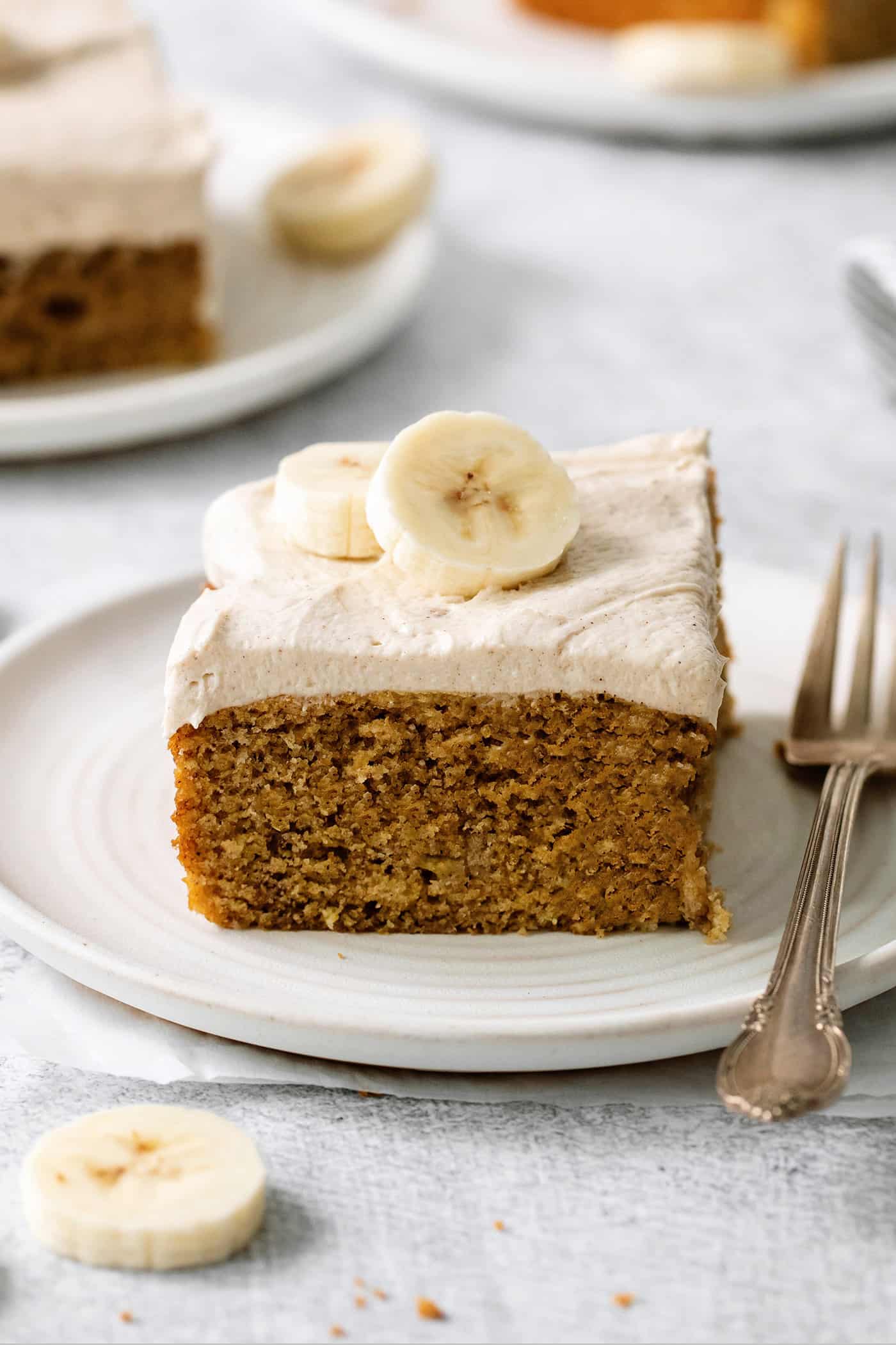 A slice of homemade banana cake on a plate