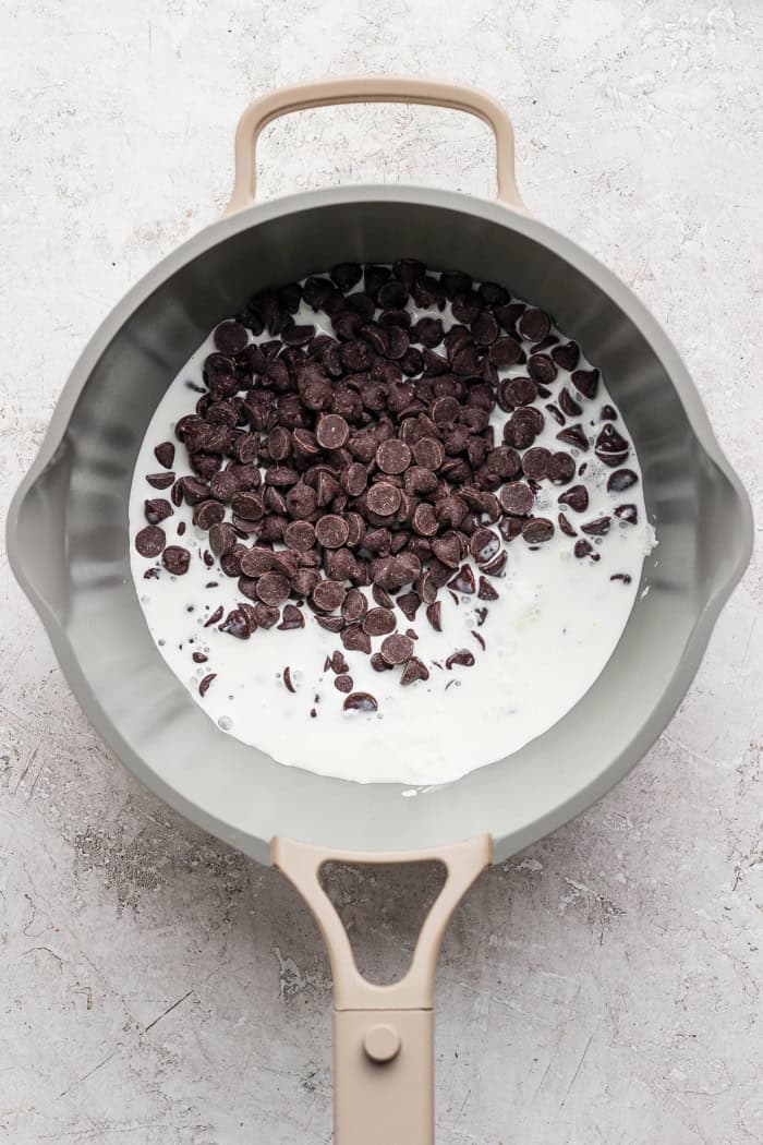 Cream and chocolate chips in pan