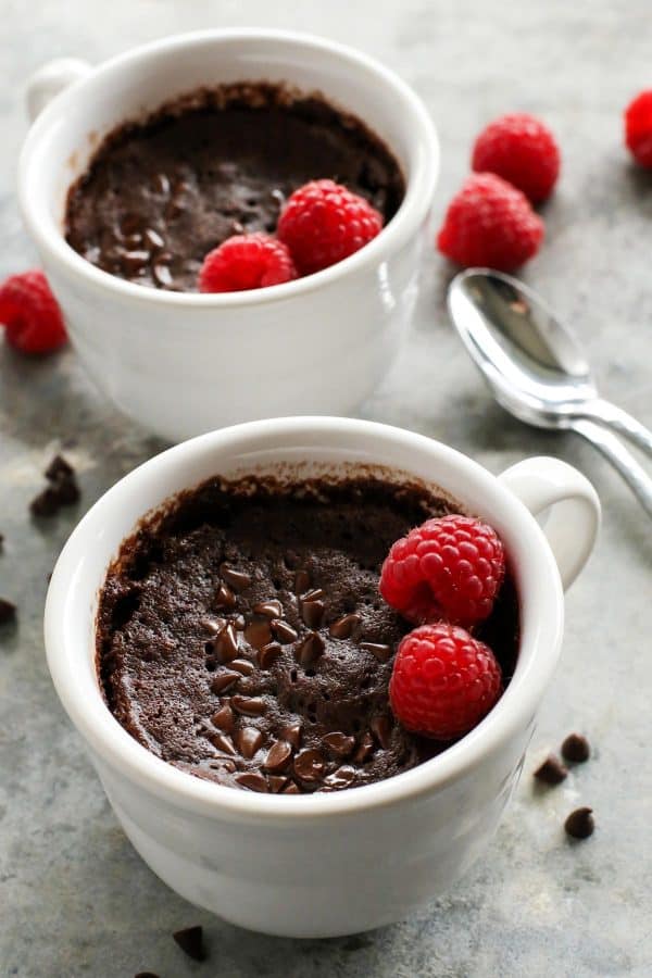 Gooey Chocolate Mug Cake for Two from afarmgirlsdabbles.com - This mug cake is incredibly easy to make, with butter and no eggs. In less than 15 minutes, you'll have two crazy delicious servings of warm chocolate cake, ready to eat! #mug #cake #chocolate #cup #microwave #easy 