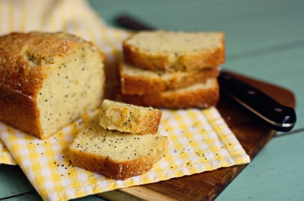 Almond Poppy Seed Bread on a Yellow Checkered Dish Towel