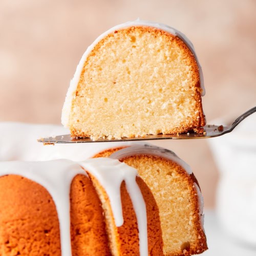 Slice of cream cheese pound cake on spatula.