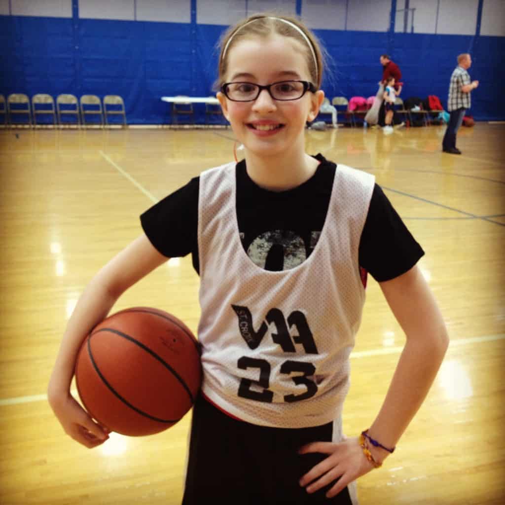 a girl playing basketball