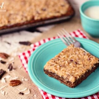 a slice of German chocolate sheet cake on a blue plate