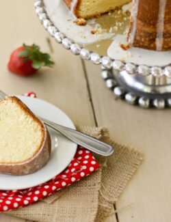 A slice of Cream Cheese Pound Cake on a white plate