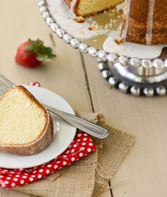 A slice of Cream Cheese Pound Cake on a white plate