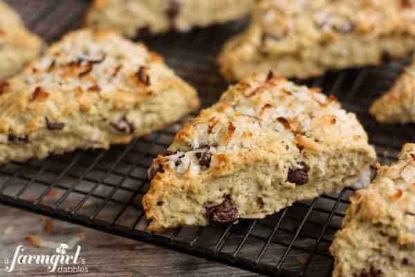 Scones with chocolate chunks and coconut on a cooling rack