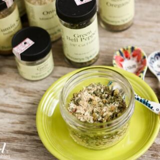 a jar of Homemade Green Taco Seasoning and different spices