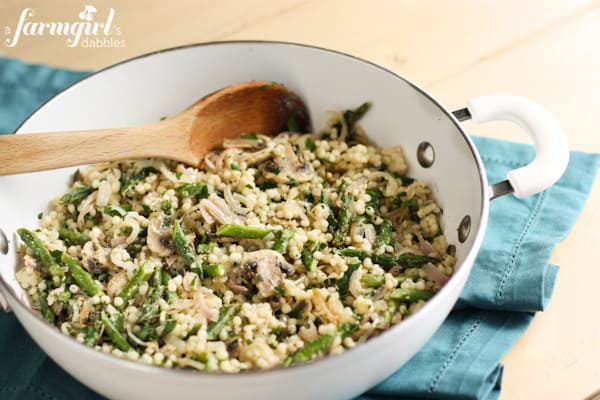 a skillet pan of Israeli Couscous with vegetables