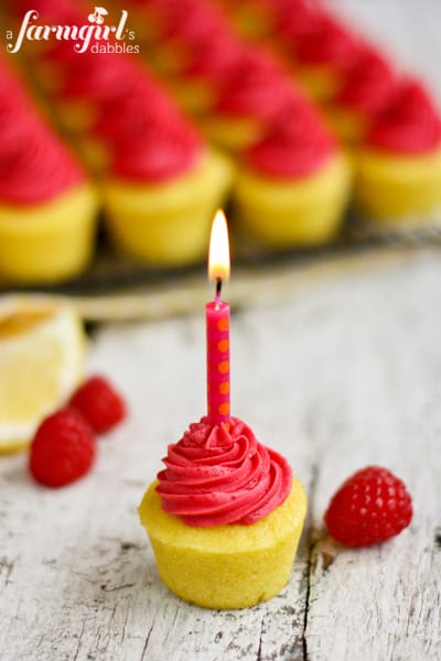 a mini cupcake with a pink candle
