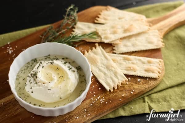 a dish of ricotta sprinkled with herbs