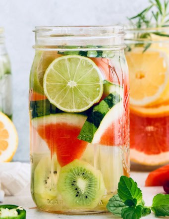 Jar of spa water with kiwi, watermelon, and lime