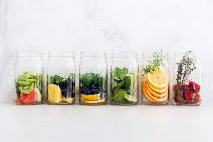 Fruit and herbs added to jars for spa water