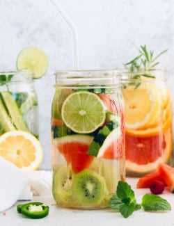 Jars of spa water with fresh fruit and herbs