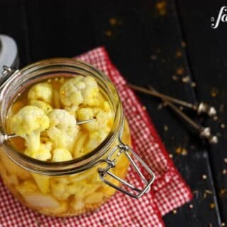 pieces of Pickled Cauliflower on a skewer