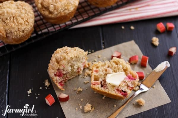 a Rhubarb Muffins sliced in half spread with butter