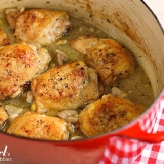 a red crockpot of Braised Chicken with Mushrooms and Green Olives