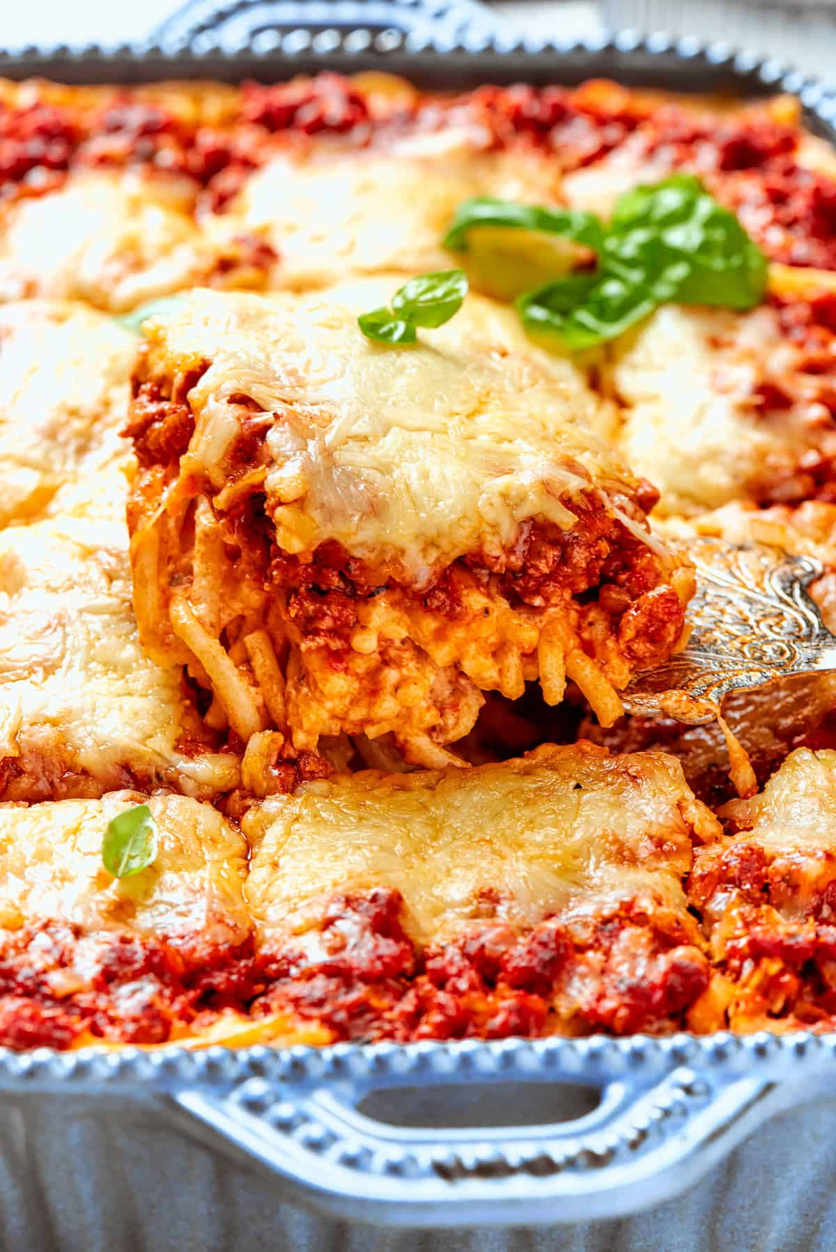 Lifting portion of spaghetti casserole from baking dish