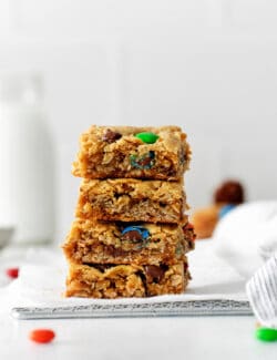 Four monster cookie bars stacked on each other