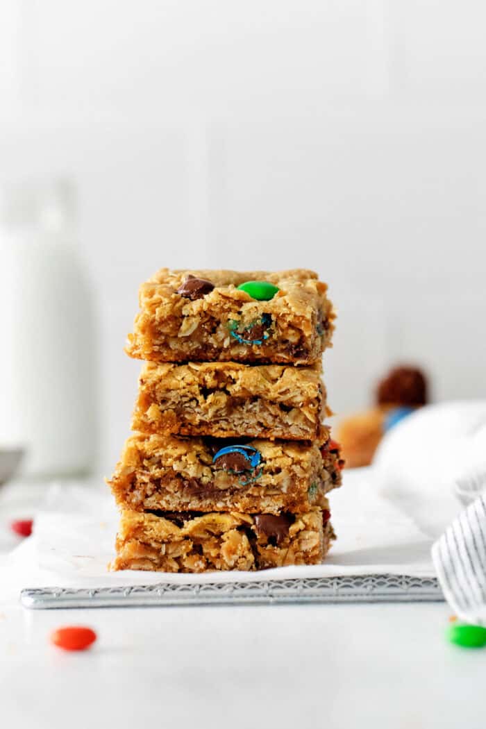 Four monster cookie bars stacked on each other