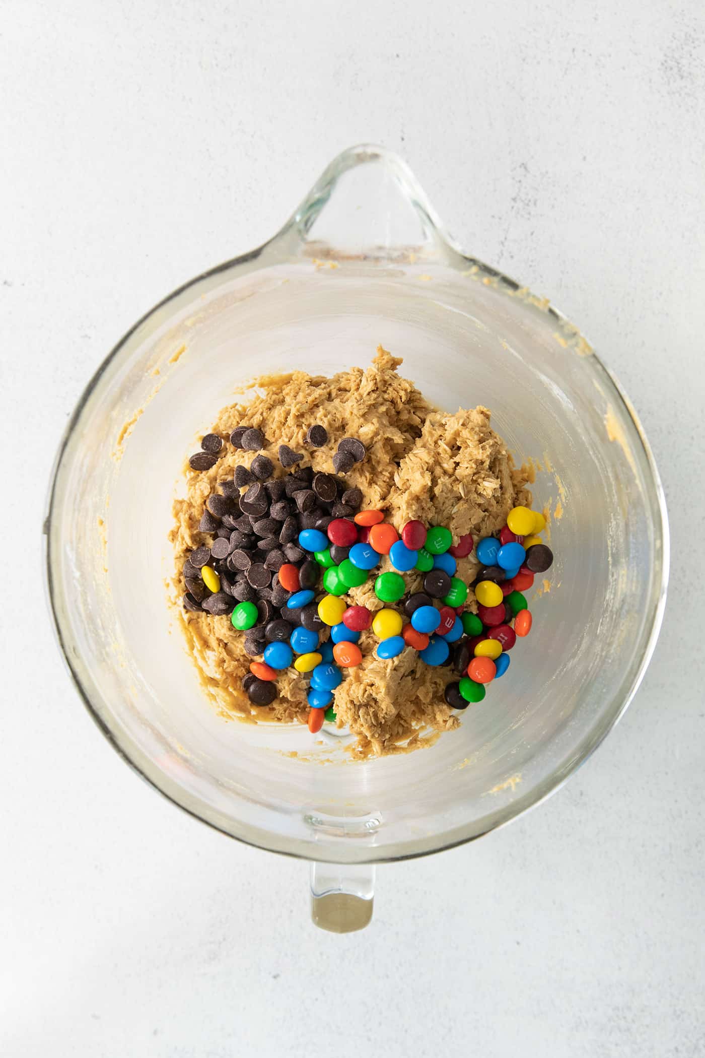 Chocolate chips and M&Ms added to cookie dough