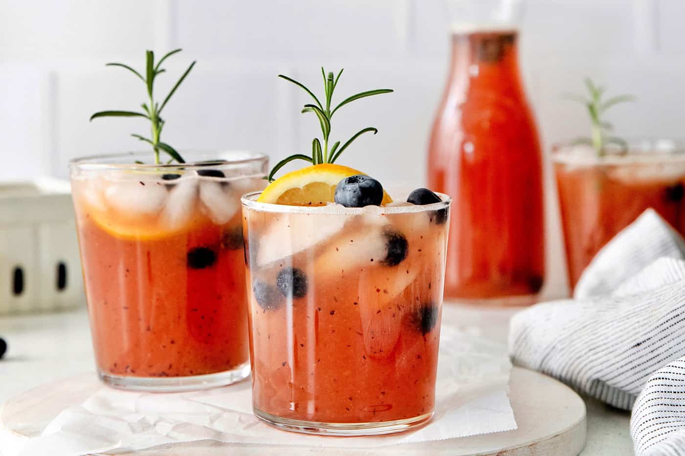 Front view of two glasses of rose bourbon and blue sangria