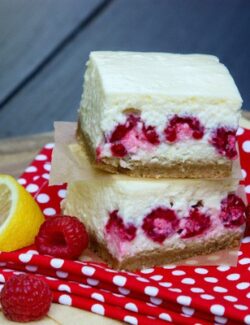 A stack of lemon and raspberry cheesecake bars