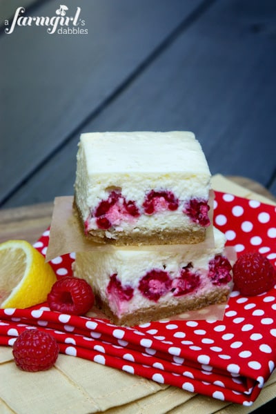 Lemon Cheesecake Bars with fresh raspberries