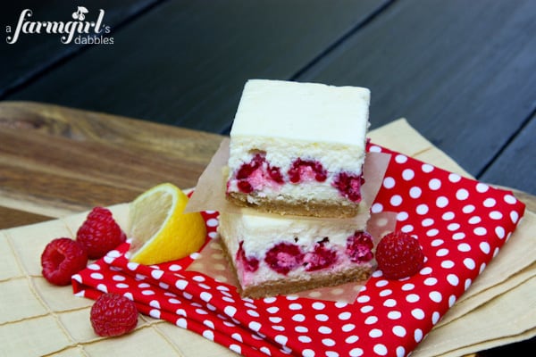 Lemon Cheesecake Bars with Raspberries - www.afarmgirlsdabbles.com