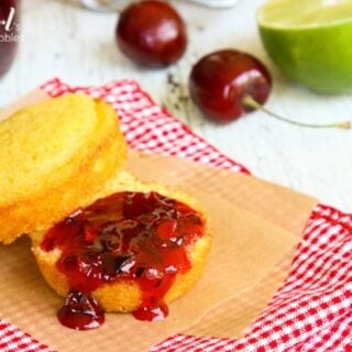 a cornbread muffin with Cherry Jam spread on top