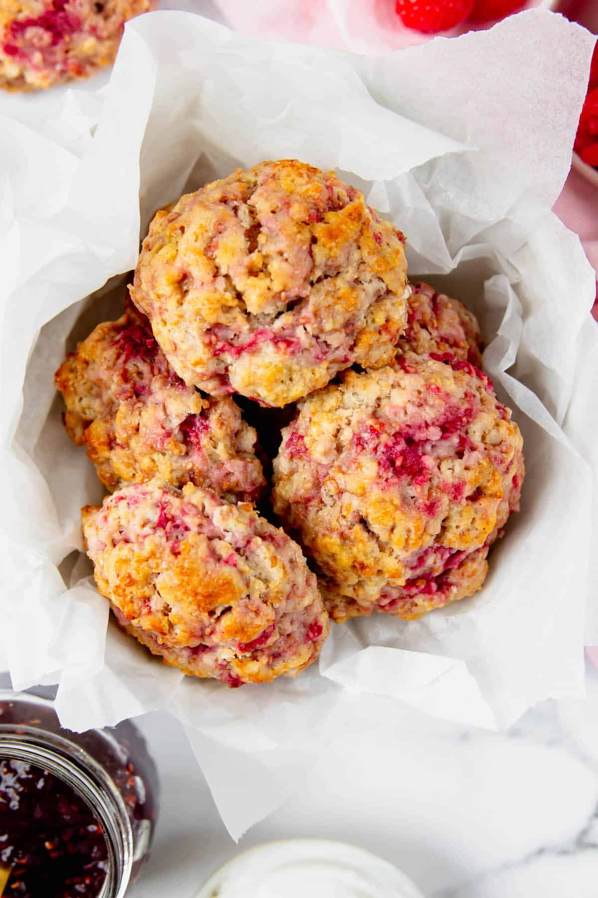 Overhead view of a basket of raspberry drop scones